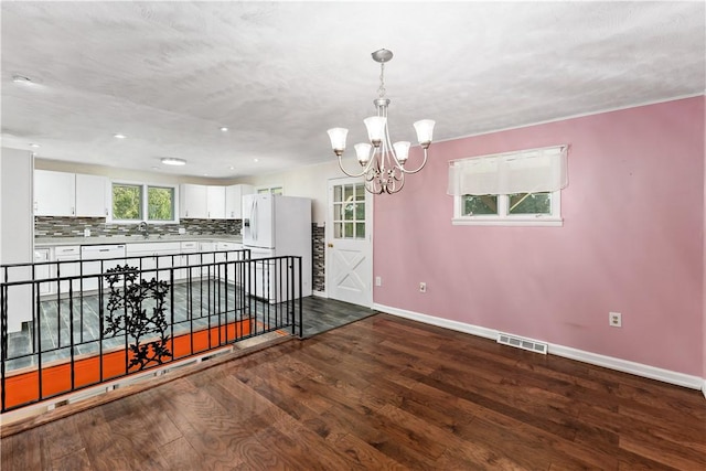 5342 Pleasant Unity Rd, Latrobe, PA 15650 - unfurnished room with a chandelier, dark wood-style flooring, and recessed lighting