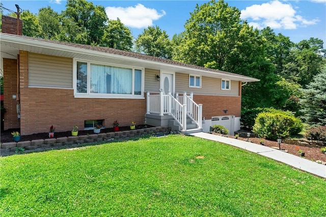 5342 Pleasant Unity Rd, Latrobe, PA 15650 - view of front of property with brick siding, a front lawn, an attached garage, and a chimney