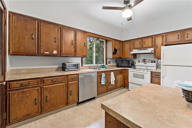 53 Fountain St, Crafton, PA 15205 - kitchen with white appliances, under cabinet range hood, brown cabinetry, and ceiling fan
