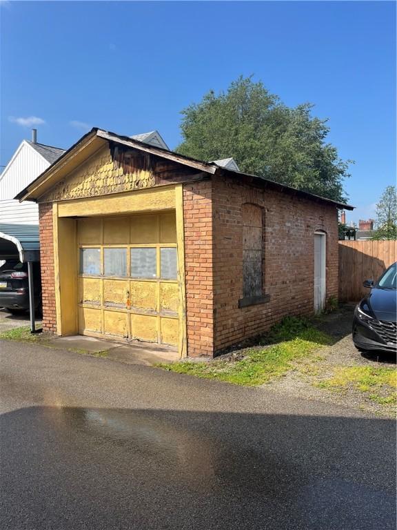 214 E Fairview Ave, Connellsville, PA 15425 - view of home's exterior with brick siding
