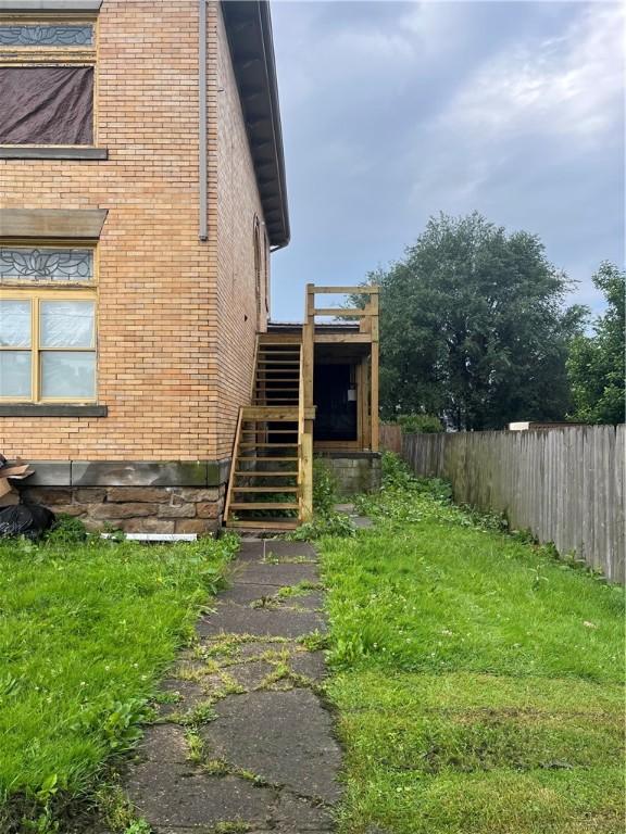214 E Fairview Ave, Connellsville, PA 15425 - view of side of property with stairway and brick siding
