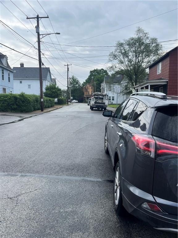 214 E Fairview Ave, Connellsville, PA 15425 - view of asphalt road featuring street lighting and a residential view