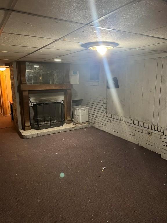 214 E Fairview Ave, Connellsville, PA 15425 - finished basement featuring a brick fireplace and a paneled ceiling