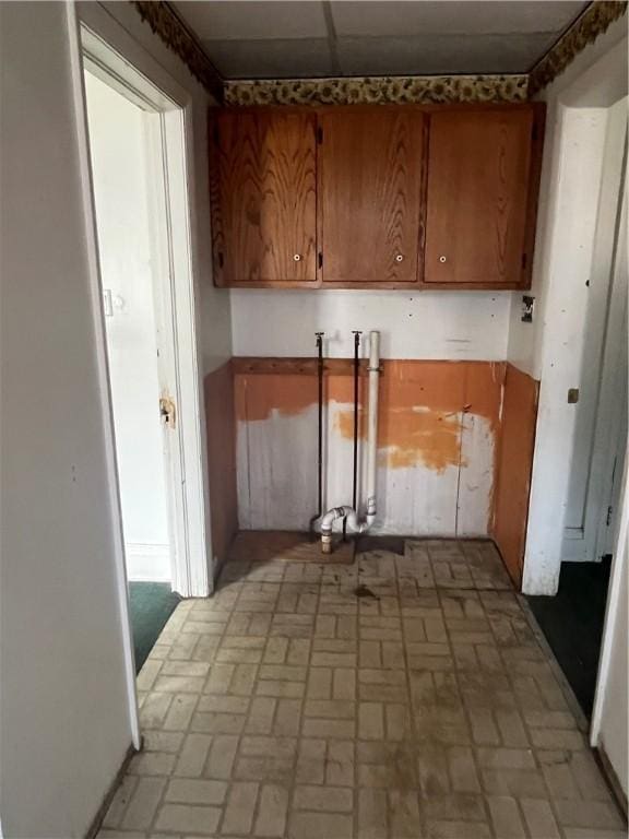 214 E Fairview Ave, Connellsville, PA 15425 - kitchen with brown cabinets and brick patterned floors