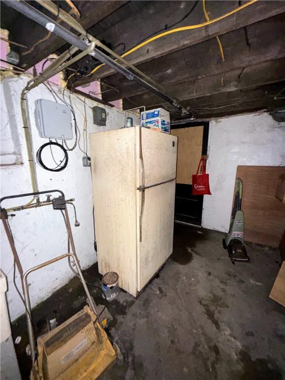 7514 Roslyn St, Swissvale, PA 15218 - unfinished below grade area featuring freestanding refrigerator