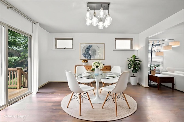 301 N Winebiddle St, Garfield, PA 15224 - dining area featuring wood finished floors and a chandelier