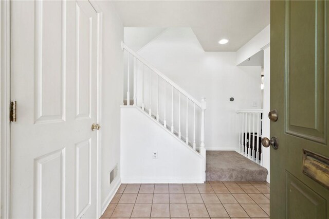 301 N Winebiddle St, Garfield, PA 15224 - entryway featuring light tile patterned floors, light carpet, stairs, and recessed lighting
