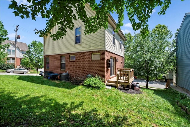 301 N Winebiddle St, Garfield, PA 15224 - back of house featuring a yard, a wooden deck, and brick siding