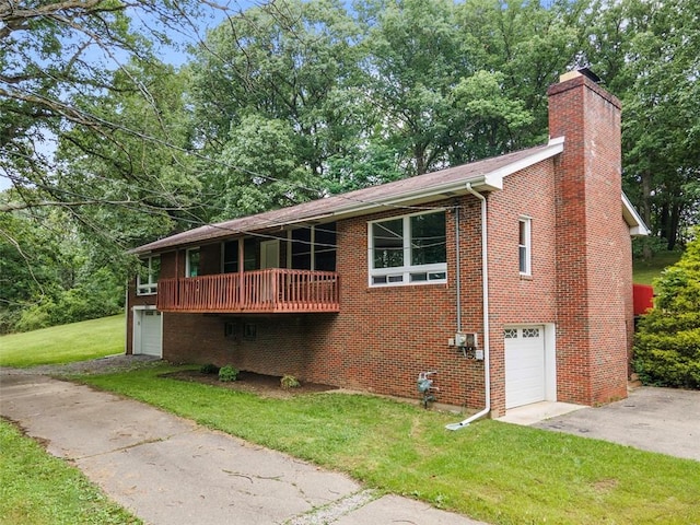 1082 N Boundary, Cranberry Twp, PA 16066 - view of front facade featuring a garage, driveway, a front yard, a chimney, and brick siding