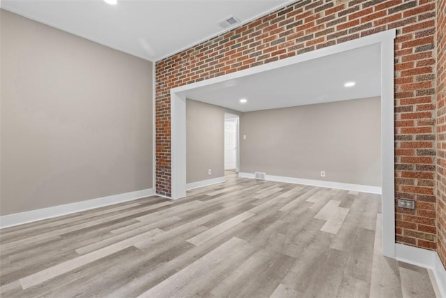 1082 N Boundary, Cranberry Twp, PA 16066 - spare room with light wood-type flooring, brick wall, and recessed lighting