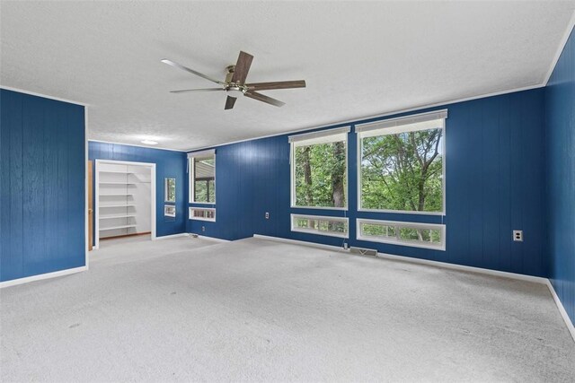 1082 N Boundary, Cranberry Twp, PA 16066 - carpeted spare room featuring a ceiling fan, a textured ceiling, and wood walls