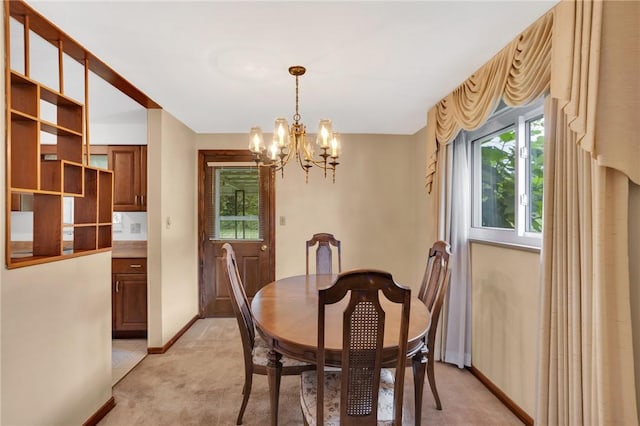 1919 Outlook Dr, Penn Hills, PA 15147 - dining area featuring light colored carpet and a chandelier