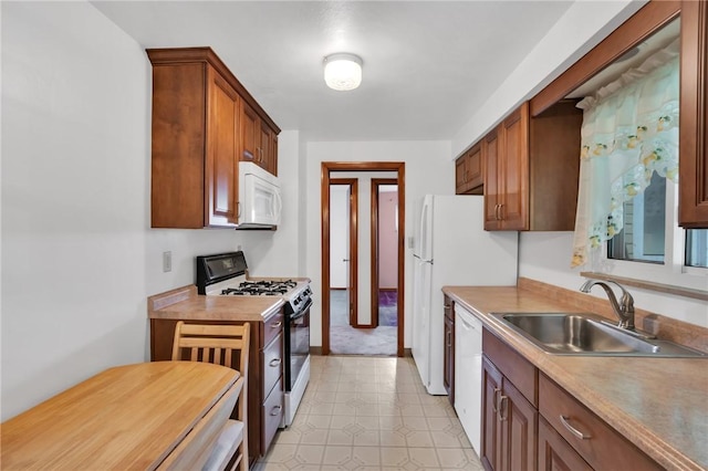 1919 Outlook Dr, Penn Hills, PA 15147 - kitchen featuring white appliances, brown cabinetry, and light countertops