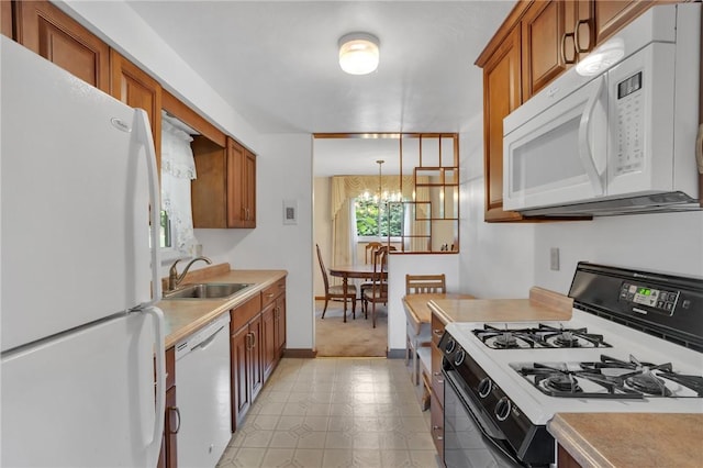 1919 Outlook Dr, Penn Hills, PA 15147 - kitchen featuring white appliances, brown cabinetry, light countertops, a chandelier, and light floors