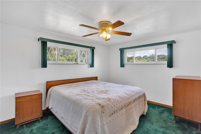 1919 Outlook Dr, Penn Hills, PA 15147 - bedroom featuring dark colored carpet, multiple windows, and a ceiling fan