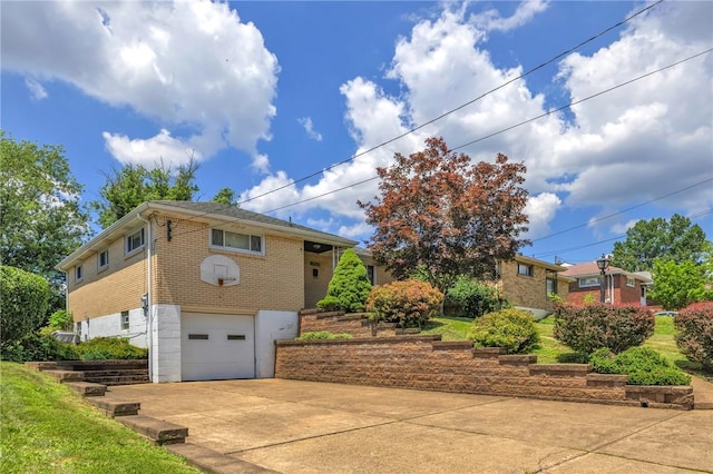 1919 Outlook Dr, Penn Hills, PA 15147 - view of property exterior featuring brick siding, a garage, and driveway