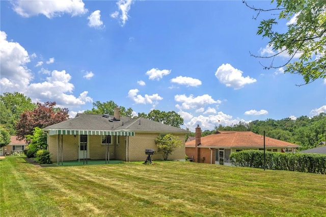 1919 Outlook Dr, Penn Hills, PA 15147 - rear view of property featuring a yard and a chimney