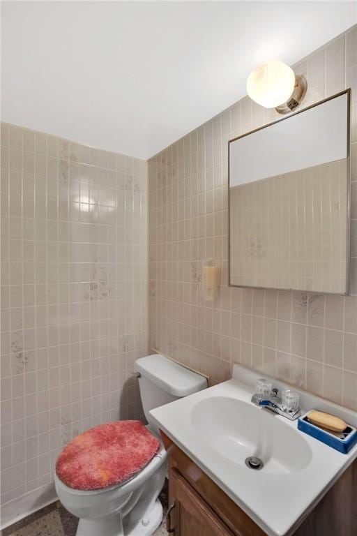 1919 Outlook Dr, Penn Hills, PA 15147 - half bathroom with tile walls, vanity, and tasteful backsplash