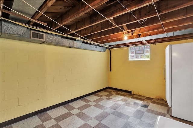 1919 Outlook Dr, Penn Hills, PA 15147 - below grade area with freestanding refrigerator and tile patterned floors