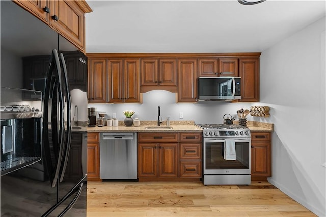 1214 Regency Dr, Mccandless, PA 15237 - kitchen with stainless steel appliances, light stone countertops, and brown cabinets