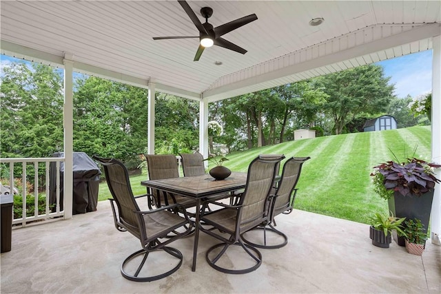 1214 Regency Dr, Mccandless, PA 15237 - view of patio featuring a shed, outdoor dining area, a ceiling fan, grilling area, and view of wooded area