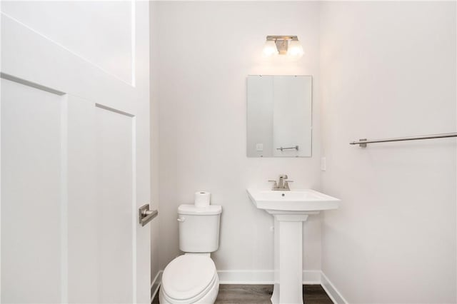 504 Nolan Cir, Cranberry Twp, PA 16066 - half bathroom with toilet and wood finished floors