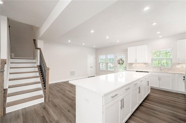 504 Nolan Cir, Cranberry Twp, PA 16066 - kitchen with recessed lighting, dark wood-style flooring, a kitchen island, backsplash, and white cabinetry