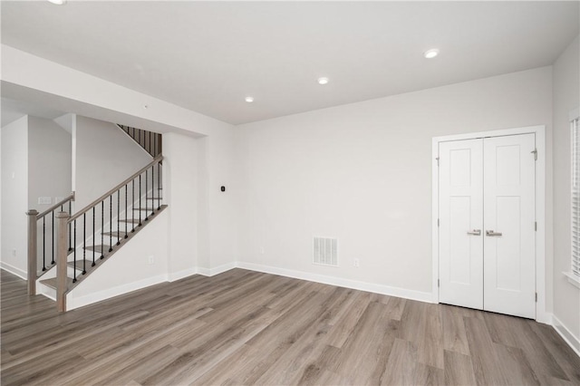 504 Nolan Cir, Cranberry Twp, PA 16066 - spare room with wood finished floors, stairs, and recessed lighting