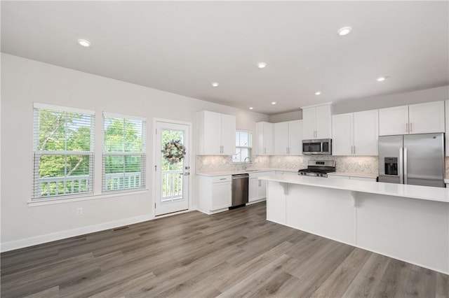 504 Nolan Cir, Cranberry Twp, PA 16066 - kitchen featuring stainless steel appliances, light countertops, tasteful backsplash, white cabinetry, and recessed lighting
