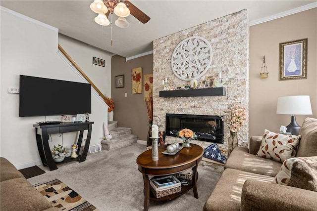 422 Ella St, Bloomfield, PA 15224 - living room with stairs, a ceiling fan, carpet, a stone fireplace, and ornamental molding