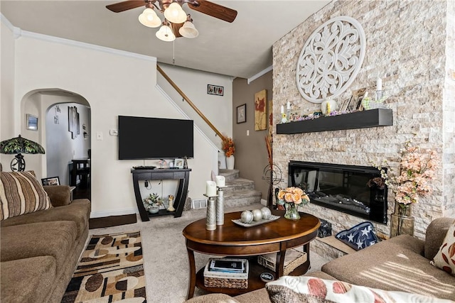 422 Ella St, Bloomfield, PA 15224 - carpeted living area with a ceiling fan, stairs, arched walkways, and a fireplace