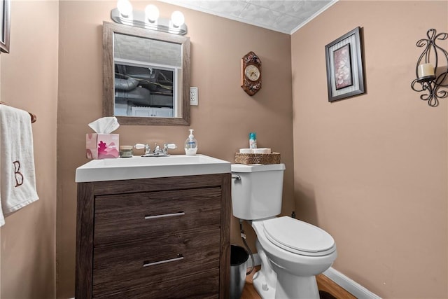 422 Ella St, Bloomfield, PA 15224 - half bath featuring vanity and wood finished floors