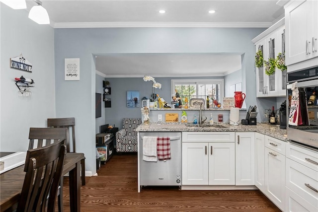 422 Ella St, Bloomfield, PA 15224 - kitchen featuring dishwashing machine, a peninsula, ornamental molding, oven, and dark wood-style flooring