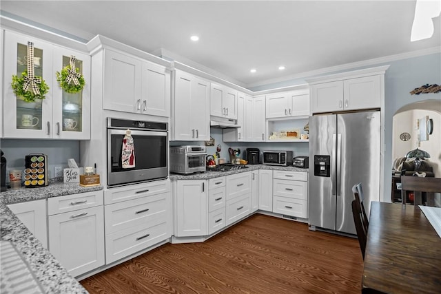 422 Ella St, Bloomfield, PA 15224 - kitchen with stainless steel appliances, under cabinet range hood, white cabinetry, ornamental molding, and light stone counters