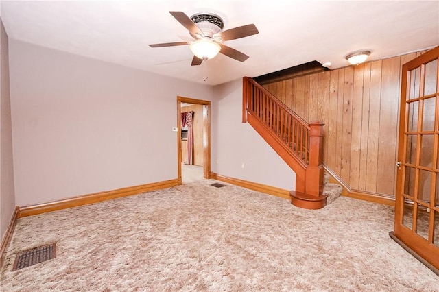 314 N 9th St, Apollo Boro, PA 15613 - carpeted spare room with ceiling fan, stairs, and wood walls