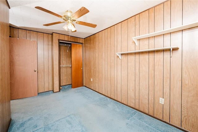 314 N 9th St, Apollo Boro, PA 15613 - unfurnished bedroom with carpet floors, wooden walls, and a ceiling fan