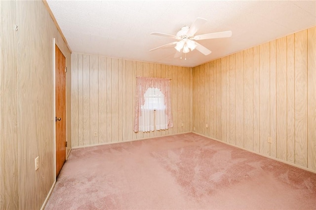 314 N 9th St, Apollo Boro, PA 15613 - carpeted empty room featuring ceiling fan and wood walls