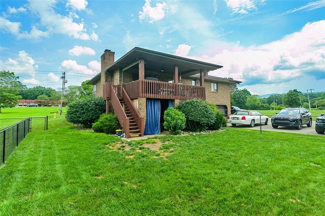 334 Park St, North Union Twp, PA 15401 - rear view of property with stairs, a chimney, a garage, and brick siding