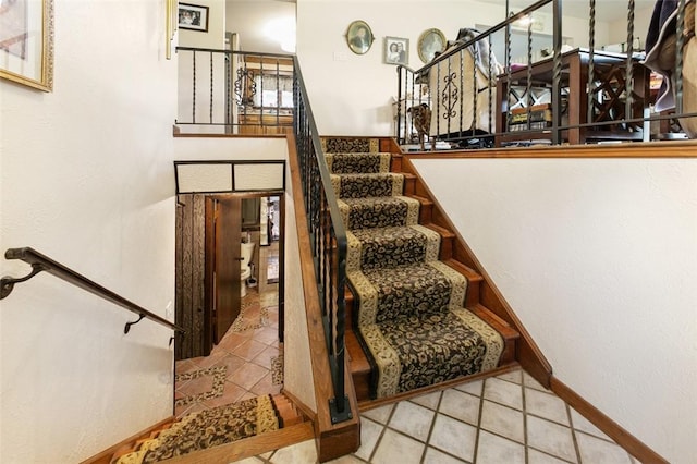 334 Park St, North Union Twp, PA 15401 - stairway featuring tile patterned floors and baseboards