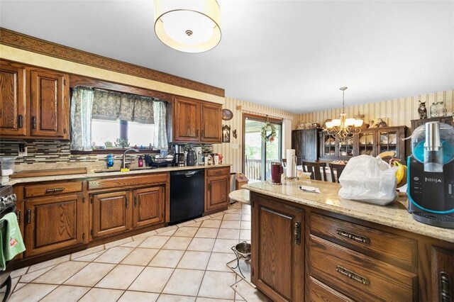 334 Park St, North Union Twp, PA 15401 - kitchen featuring black dishwasher, a chandelier, decorative light fixtures, wallpapered walls, and brown cabinetry
