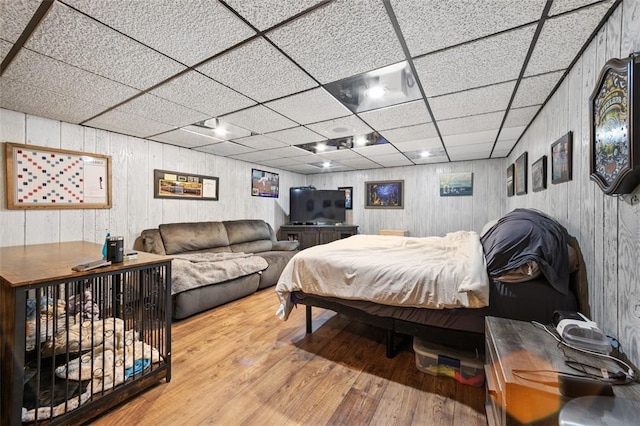 334 Park St, North Union Twp, PA 15401 - bedroom featuring wood finished floors, a paneled ceiling, and wood walls