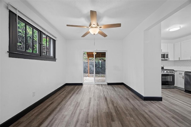 1462 Elm St, Wilkinsburg, PA 15221 - empty room with wood finished floors and ceiling fan