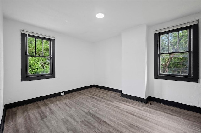 1462 Elm St, Wilkinsburg, PA 15221 - unfurnished room with healthy amount of natural light and wood finished floors