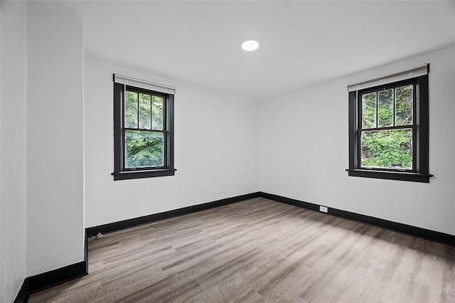 1462 Elm St, Wilkinsburg, PA 15221 - empty room with wood finished floors and recessed lighting