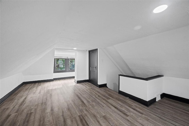 1462 Elm St, Wilkinsburg, PA 15221 - additional living space featuring wood finished floors and vaulted ceiling