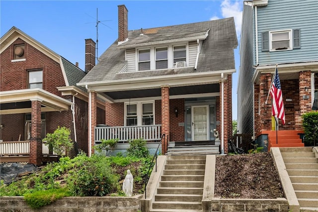 1860 Jancey St, Morningside, PA 15206 - view of front of property with stairway, covered porch, a chimney, and brick siding
