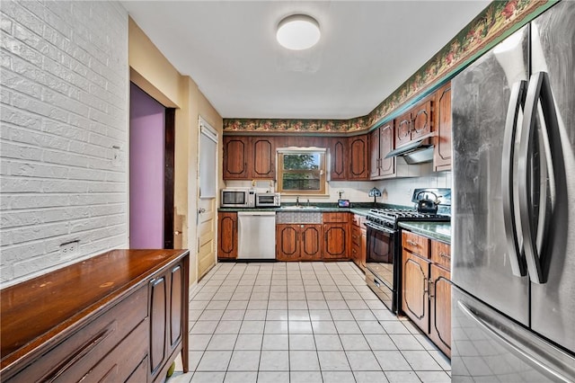 1860 Jancey St, Morningside, PA 15206 - kitchen with appliances with stainless steel finishes, light tile patterned floors, dark countertops, and under cabinet range hood
