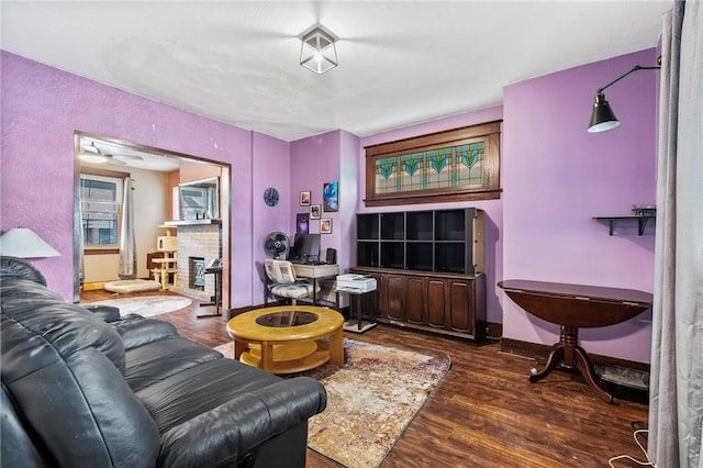 1860 Jancey St, Morningside, PA 15206 - living room featuring wood finished floors and a brick fireplace