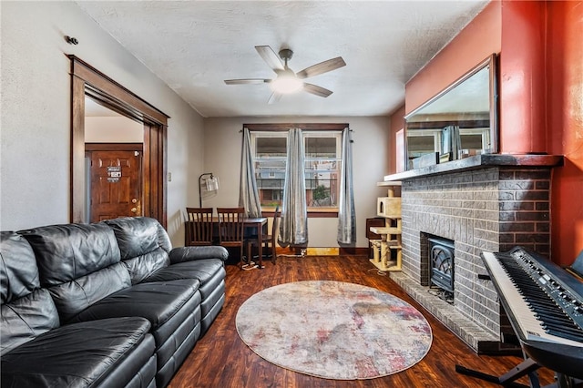 1860 Jancey St, Morningside, PA 15206 - living room featuring wood finished floors, a ceiling fan, and a brick fireplace