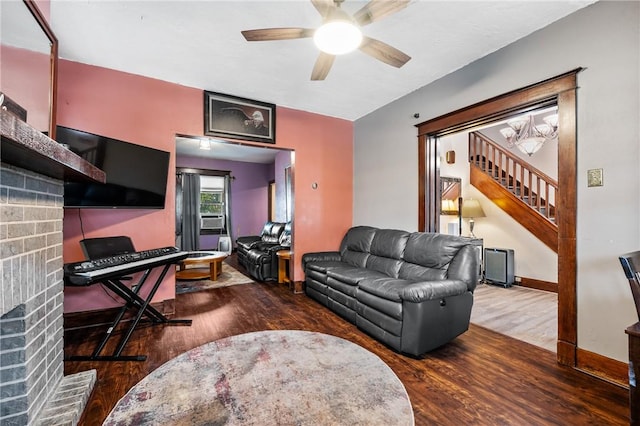 1860 Jancey St, Morningside, PA 15206 - living room featuring stairs, wood finished floors, a fireplace, a ceiling fan, and cooling unit
